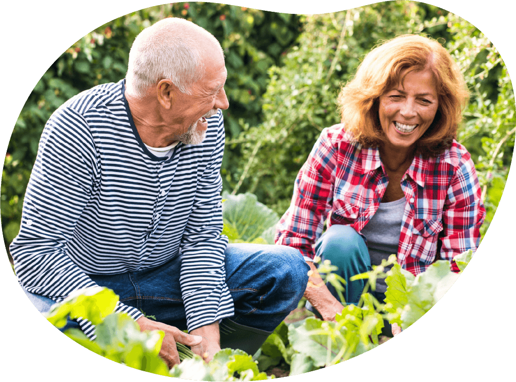 Senior couple gardening pain-free after non-surgical shoulder treatment